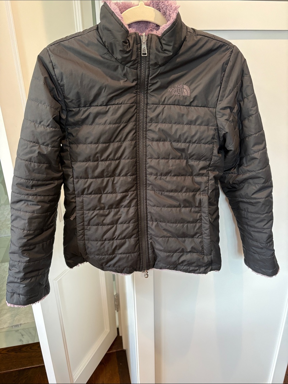 The North Face Womenโs Black Puffer Jacket with Lavender Fleece Collar